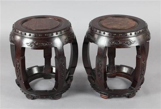 A pair of Chinese hongmu barrel shaped stools, late 19th / early 20th century, H.46cm Diameter 43cm
